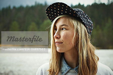 Portrait of woman wearing cap headwear