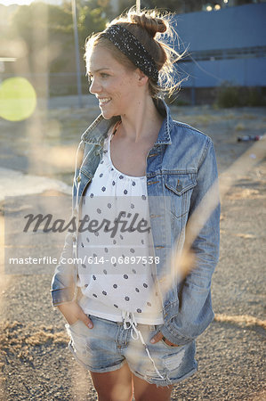 Woman standing in industrial area