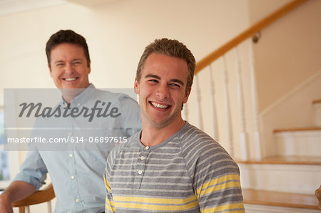 Father and adult son, laughing