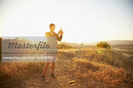 Woman photographing scenery