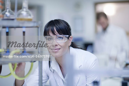 Oenologist monitoring sample testing in laboratory