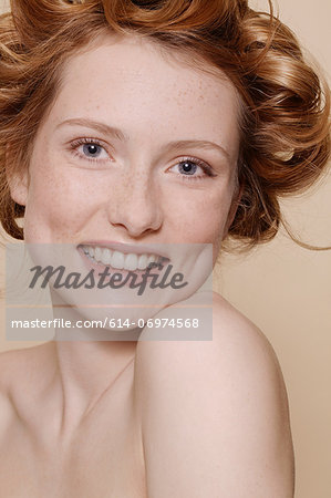 Young woman with curly red hair, portrait