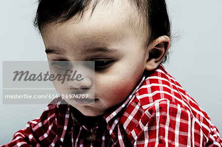 Portrait of baby boy wearing checked shirt