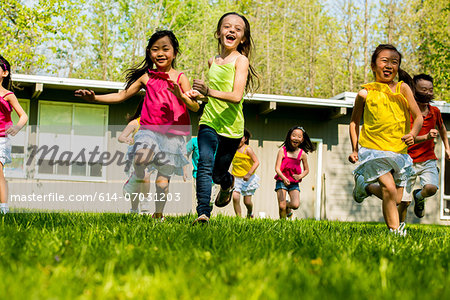 Children running on grass