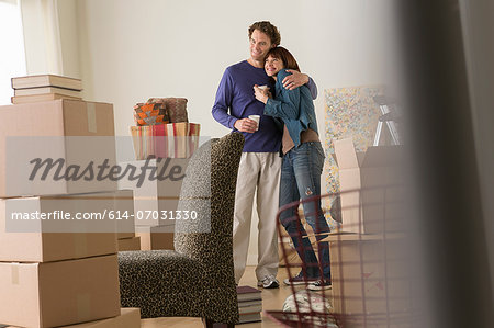 Couple having a drink break whilst moving
