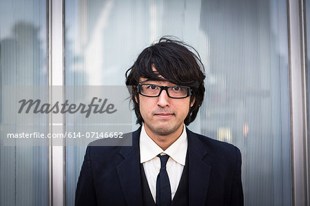 Portrait of young businessman wearing glasses