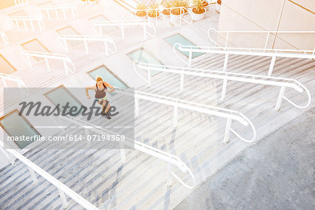 Woman running up stairs Woman running up stairs