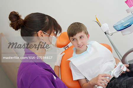 Patient practicing dental brushing on dentures