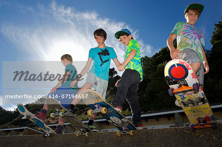 Portrait of four boys on skateboards
