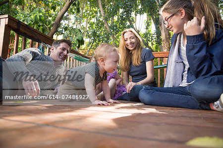 Family relaxing on porch