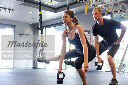 Couple working out with weights