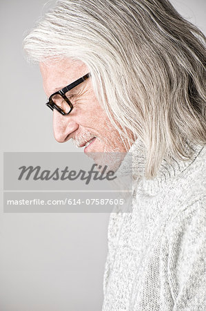 Portrait of mature man, side view, looking down