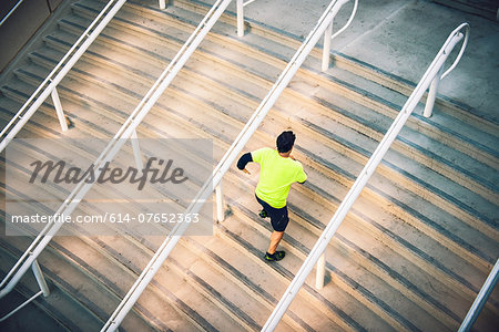 Mature male runner training on steps