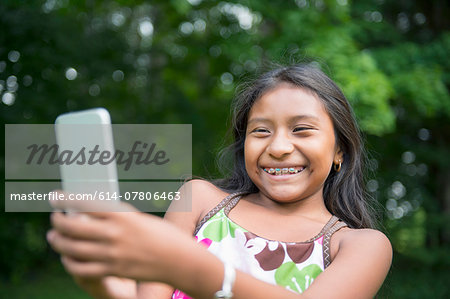 Girl taking selfie in garden