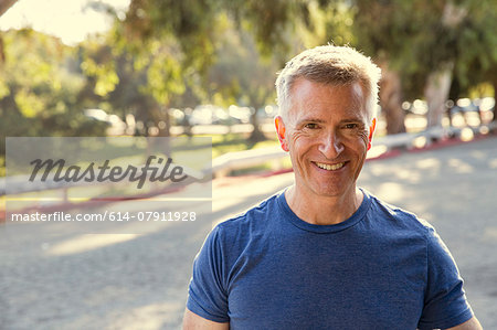 Portrait of smiling mature man in park