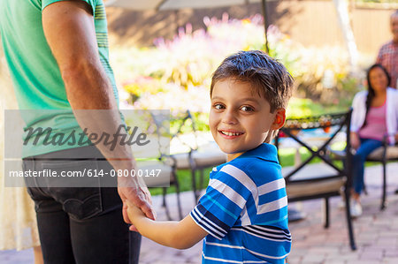 Father with son looking over shoulder