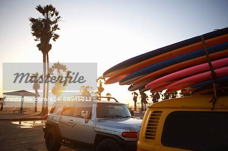 Multi-coloured surfboards tied onto vehicle, Venice Beach, Los Angeles, USA