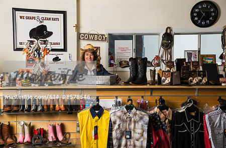 Shop assistant behind service counter