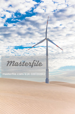 Wind turbine in desert dunes, Taiba, Ceara, Brazil