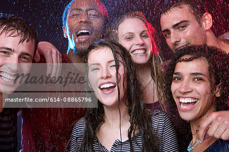 Group of young friends in the rain