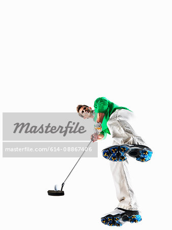 Man playing golf shot