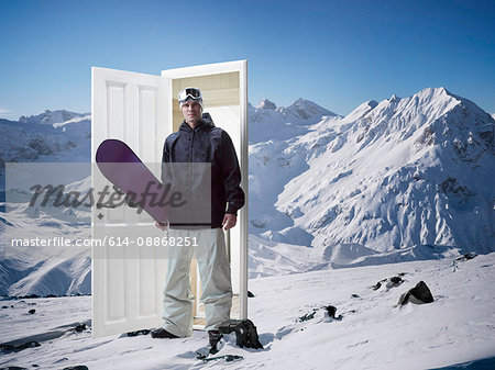Man emerging from door on mountain