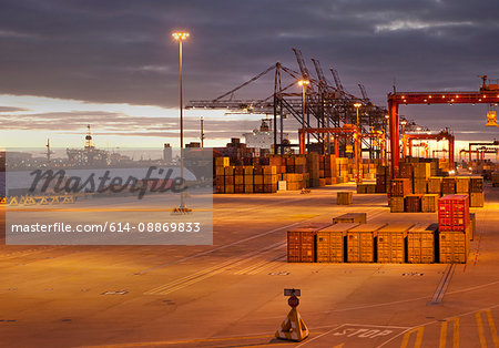 Cranes and containers in shipyard