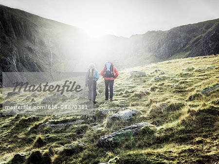 Couple hiking in rocky landscape