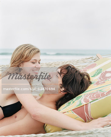 Couple laying on beach together