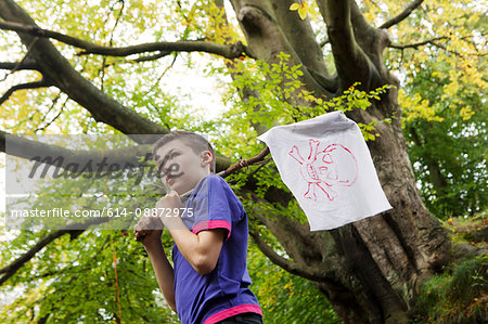 Boy holding a pirate flag