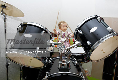 Baby girl playing drums