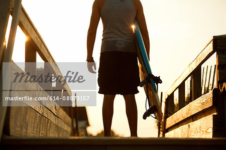 Teenager standing in anticipation ready to surf