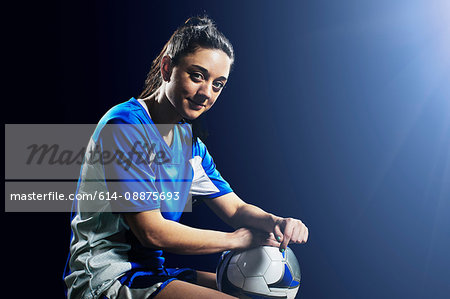 Studio shot of female soccer player