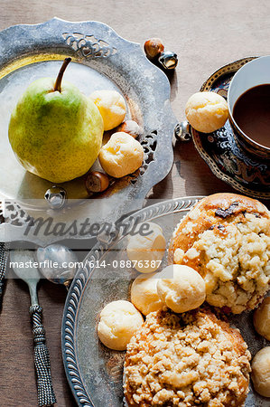 Muffins and pastry puffs with a pear
