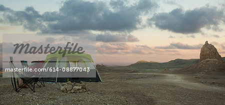 Tent and off road vehicle in front of Trona Pinnacles at dusk, Trona, California, USA