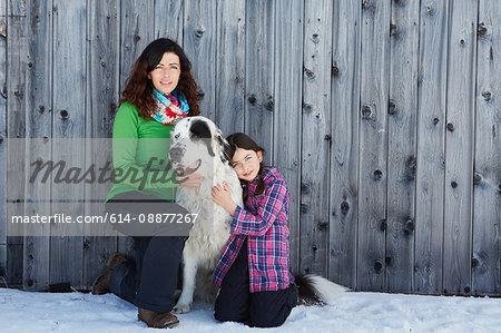 Mother and daughter with their pet dog