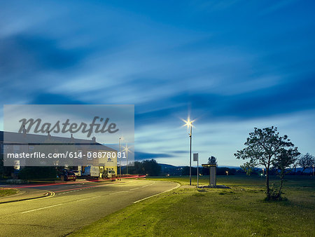 Light trails on road at night in residential area