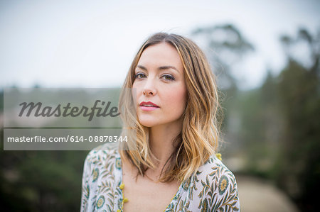 Woman in floral patterned blouse