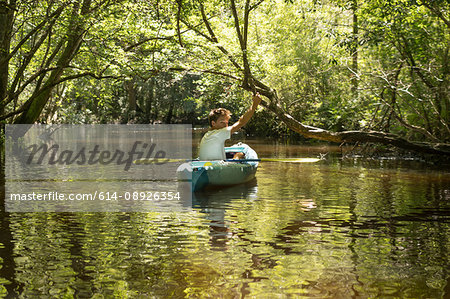 Teenage boy in kayak, Econfina Creek, Youngstown, Florida, USA