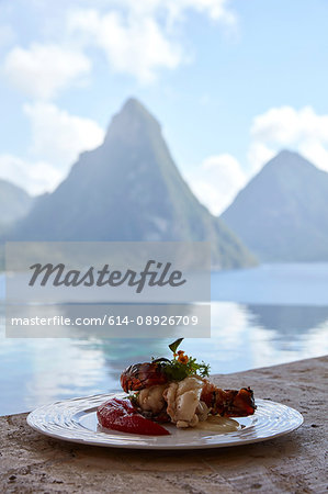 Fresh local lobster dish with view of the Pitons, Saint Lucia, Caribbean