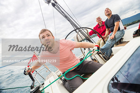 Three generation family on sailing boat, Geneva, Switzerland, Europe