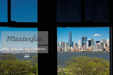 Silhouetted window frame view of Manhattan cityscape and skyline, Times Square, New York, USA