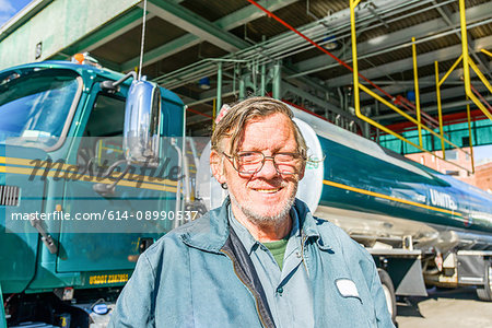 Portrait of male trucker at biofuel industrial plant