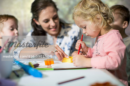 Teacher and children drawing