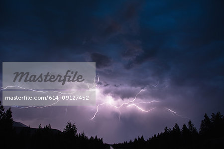 Lightning in sky over Canadian Rocky Mountains, Kootenay Region, Fernie, British Columbia, Canada