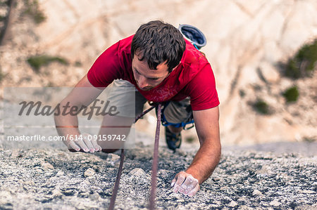 Rock climber rock climbing, Yosemite National Park, United States