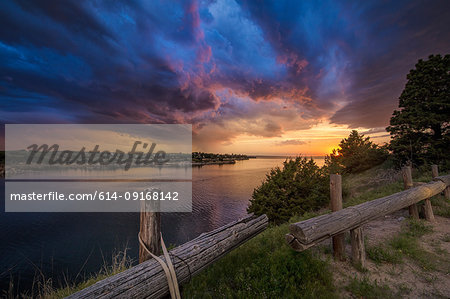 Fading supercell over lake at sunset, Ogallala, Nebraska, US