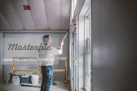 Painter decorator working inside building