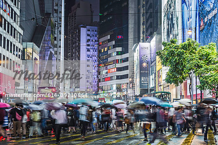 Crowded pedestrian crossing at night, Hong Kong, China