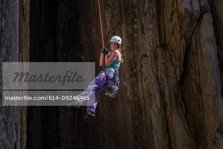 Climber rock climbing, Cookie Cliff, Yosemite National Park, California, United States